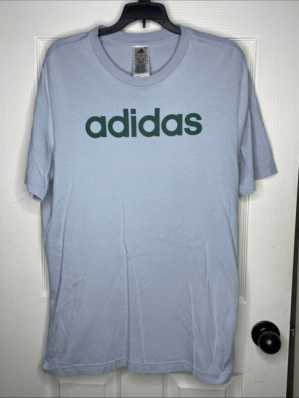 adidas Light Blue T-Shirt with Dark Green Logo. Size L